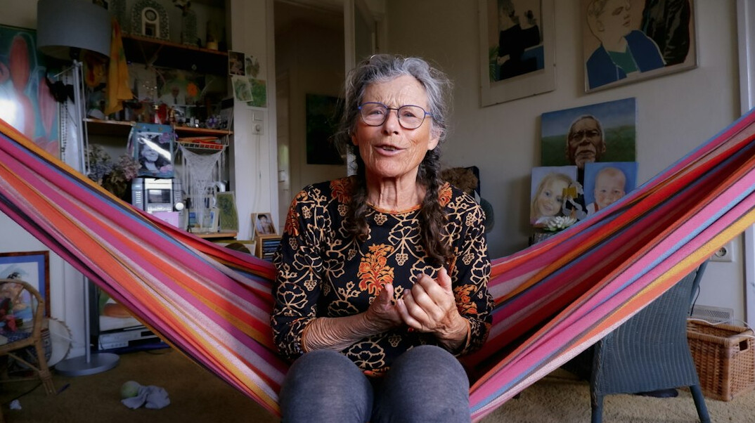 Older woman having a video call on a tablet at home