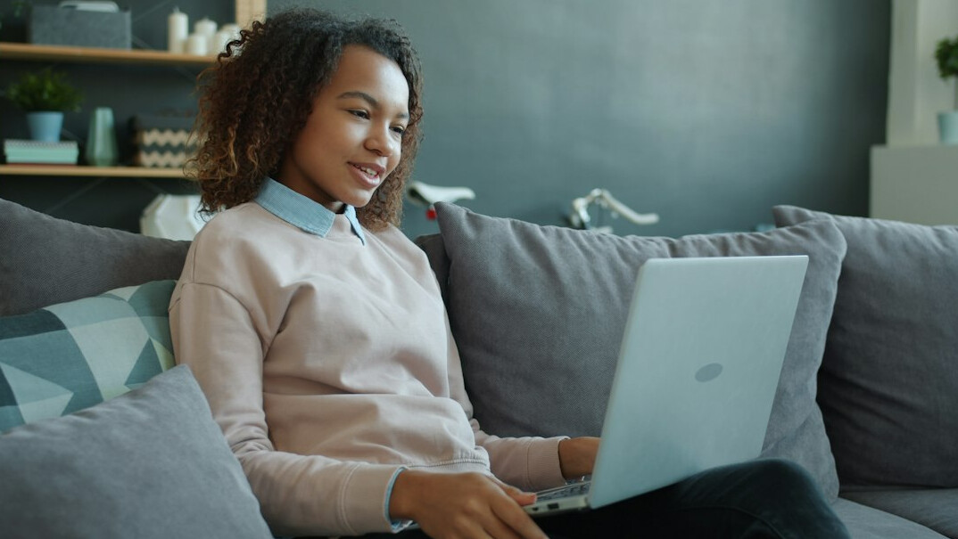 woman using laptop at home