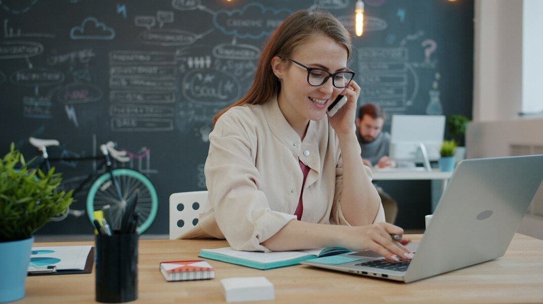 woman using laptop at desk