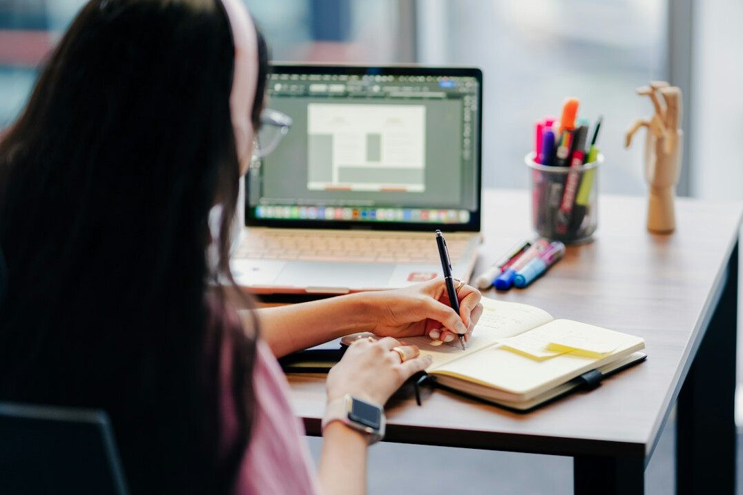 woman editing photos on laptop