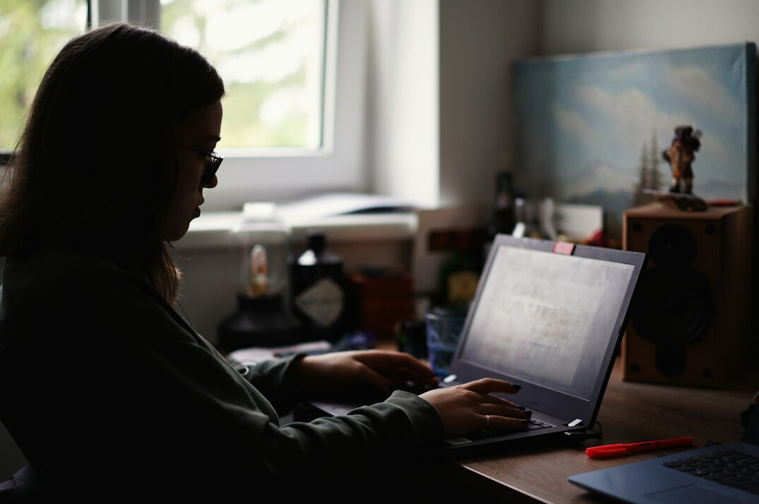 woman working on laptop at home