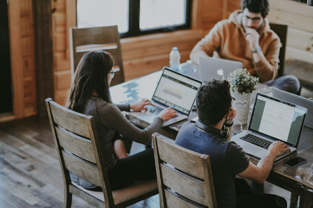 team collaborating on computer