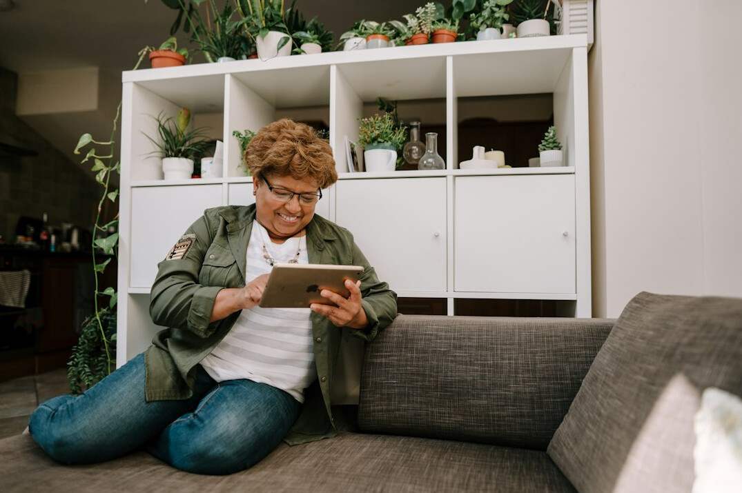 woman working remotely on tablet